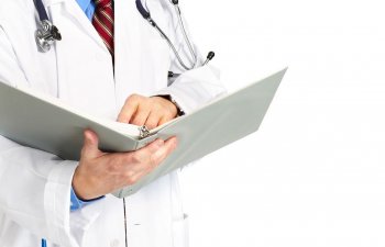 doctor revising medical records